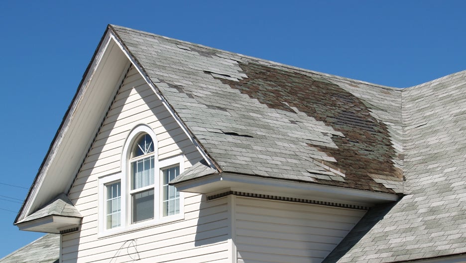 A house with a damaged roof