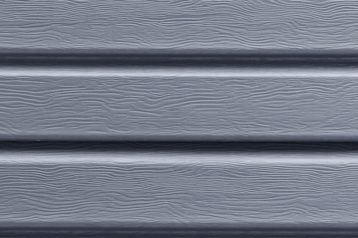 Gray siding panel with horizontal lines. Siding texture