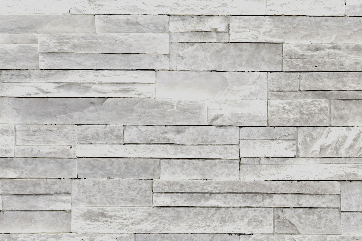 Grey stone wall texture. A background of grey stone bricks.