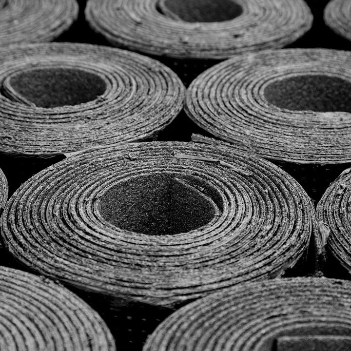 Rolled materials in circular patterns. Stacked rolls.