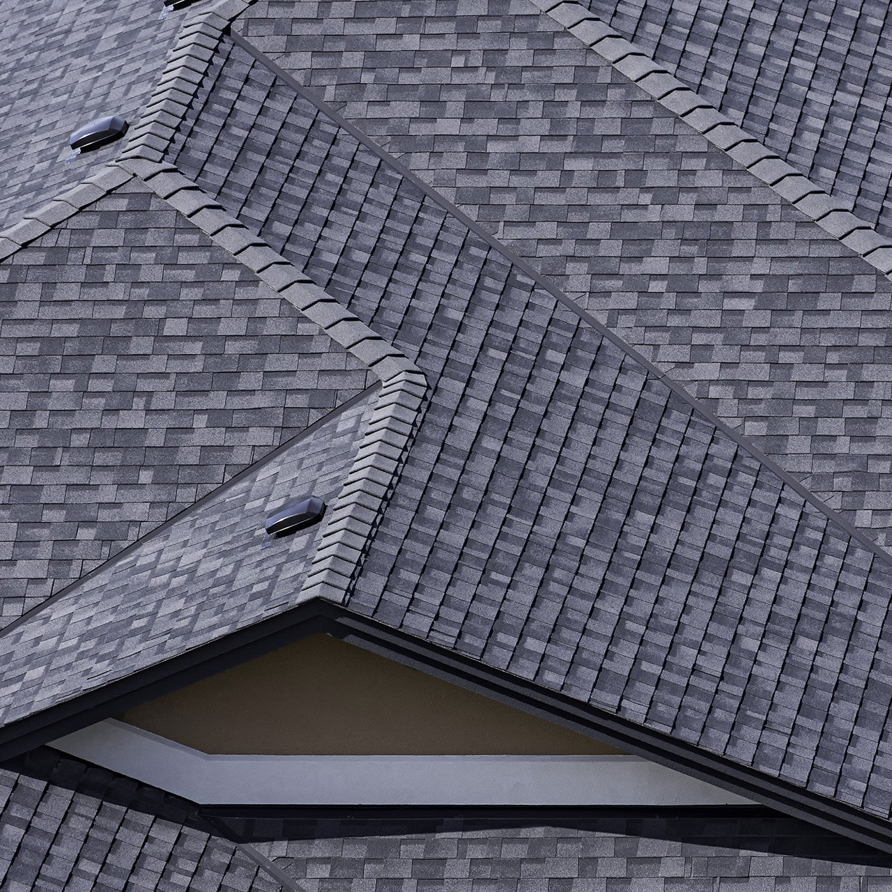 Roof with Shingles and Skylight A roof with gray shingles and a skylight.